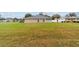 Spacious backyard showcasing ample green space, offering potential for gardening or recreation at 2105 Sw 4Th St, Ocala, FL 34471