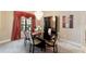 Stylish dining room with a sleek black table, elegant chairs, and modern chandelier at 2105 Sw 4Th St, Ocala, FL 34471
