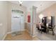 Welcoming entryway with tile flooring, elegant lighting, and a glimpse into the dining area at 2105 Sw 4Th St, Ocala, FL 34471