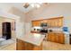 Well-equipped kitchen featuring warm wood cabinetry and stainless steel appliances at 2105 Sw 4Th St, Ocala, FL 34471