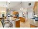Spacious kitchen featuring tile floors, a center island, breakfast bar, and stainless steel appliances at 2105 Sw 4Th St, Ocala, FL 34471