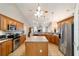 Spacious kitchen with stainless appliances, center island, and tile flooring at 2105 Sw 4Th St, Ocala, FL 34471