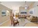 Spacious living room featuring neutral tones, tile floors and cozy seating at 2105 Sw 4Th St, Ocala, FL 34471