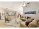 Spacious living room featuring neutral tones, tile floors and cozy seating at 2105 Sw 4Th St, Ocala, FL 34471