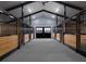 Spacious barn aisle with multiple horse stalls at 2190 Nw 110Th Ave, Ocala, FL 34482