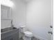 Simple bathroom with gray vanity and vinyl flooring at 2190 Nw 110Th Ave, Ocala, FL 34482