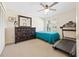 Bedroom with a treadmill and built-in closet at 22202 Sandalwood Dr # 202, Wildwood, FL 34785