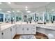Large bathroom with a corner vanity and ample mirror space at 2263 Se Laurel Run Dr, Ocala, FL 34471