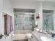 Bathroom with granite vanity and walk-in shower at 2263 Se Laurel Run Dr, Ocala, FL 34471