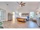 Spacious primary bedroom with hardwood floors and ensuite bathroom access at 2263 Se Laurel Run Dr, Ocala, FL 34471
