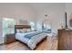 Main bedroom with wood floors and large mirror at 2263 Se Laurel Run Dr, Ocala, FL 34471