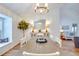 Bright dining area with a rustic wood table and chandelier at 2263 Se Laurel Run Dr, Ocala, FL 34471