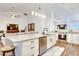 Open concept kitchen with island, stainless steel appliances, and granite countertops at 2263 Se Laurel Run Dr, Ocala, FL 34471