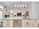 Island kitchen with granite countertops and stainless steel appliances at 2263 Se Laurel Run Dr, Ocala, FL 34471