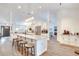Modern kitchen with large island, white cabinets, and stainless steel appliances at 2263 Se Laurel Run Dr, Ocala, FL 34471