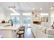 Open floor plan with kitchen island, granite counters, and living room at 2263 Se Laurel Run Dr, Ocala, FL 34471