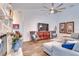 Living room featuring a stone fireplace and comfortable seating at 2263 Se Laurel Run Dr, Ocala, FL 34471