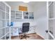 Bright home office with built-in shelving and hardwood floors at 2263 Se Laurel Run Dr, Ocala, FL 34471