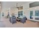 Outdoor patio area with wicker furniture and string lights at 2263 Se Laurel Run Dr, Ocala, FL 34471