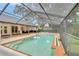 Refreshing screened pool and spa with ample deck space at 2263 Se Laurel Run Dr, Ocala, FL 34471