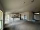 Open-concept home featuring a large living room, kitchen, and large windows to let light in at 3 Willow Trl, Ocala, FL 34472