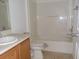 Bathroom with bathtub, toilet, and vanity at 321 Katherine Pl, The Villages, FL 32162