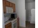 Kitchen with microwave, oven and stovetop at 321 Katherine Pl, The Villages, FL 32162