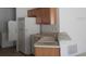 Galley kitchen with white appliances at 321 Katherine Pl, The Villages, FL 32162