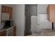 Efficient kitchen with appliances and wood cabinets at 321 Katherine Pl, The Villages, FL 32162