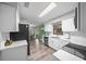 Modern kitchen with stainless steel appliances and white cabinetry at 4055 Ne 29Th Ct, Ocala, FL 34479