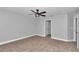 Well-lit bedroom with ceiling fan and neutral decor at 4065 Sw 5Th Ave, Ocala, FL 34471