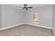 Bright bedroom with ceiling fan and carpet at 4065 Sw 5Th Ave, Ocala, FL 34471
