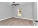 Bright bedroom with ceiling fan and carpet at 4065 Sw 5Th Ave, Ocala, FL 34471