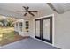 Covered patio with a ceiling fan and french doors leading inside at 4065 Sw 5Th Ave, Ocala, FL 34471