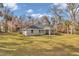 Rear view of the house showcasing the backyard and patio at 4065 Sw 5Th Ave, Ocala, FL 34471