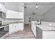 Open kitchen boasting granite countertops, stainless steel appliances, and white cabinets at 4065 Sw 5Th Ave, Ocala, FL 34471