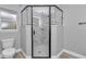 Modern shower with marble tile and glass enclosure at 4065 Sw 5Th Ave, Ocala, FL 34471