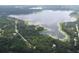 Aerial view of homes and lake at 4698 Sw Zinnia, Dunnellon, FL 34431