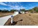 Newly constructed home with attached garage and a neat lawn at 4698 Sw Zinnia, Dunnellon, FL 34431