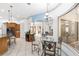 Kitchen breakfast nook with glass-top table and chairs at 609 Se 47Th Loop, Ocala, FL 34480