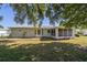 Spacious backyard with chain link fence, mature trees, and lush greenery offering great privacy at 6184 Sw 101St Pl, Ocala, FL 34476