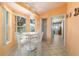 Cozy breakfast nook with ample windows, a white table set, and tile flooring at 6184 Sw 101St Pl, Ocala, FL 34476