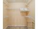 Walk-in closet featuring wire shelving and neutral tile flooring at 6184 Sw 101St Pl, Ocala, FL 34476