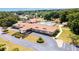Aerial view showcasing the community clubhouse and pool, providing a resort-like experience for residents at 6184 Sw 101St Pl, Ocala, FL 34476