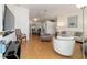 Bright living room with an open floor plan, light wood floors, and modern furnishings at 6184 Sw 101St Pl, Ocala, FL 34476