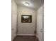 Bright hallway with two doors and wood-look flooring at 6483 Sw 204Th Ave, Dunnellon, FL 34431