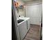 Laundry room with Samsung washer and dryer and storage shelves at 6483 Sw 204Th Ave, Dunnellon, FL 34431