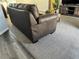 Living room features a dark leather couch at 6671 Se 108Th St, Belleview, FL 34420