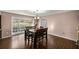 Bright dining room with wood floors and large window at 6685 Sw 18Th Terrace Rd, Ocala, FL 34476