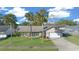 Single-story house with palm trees and a large yard at 772 Horseman Dr, Port Orange, FL 32127